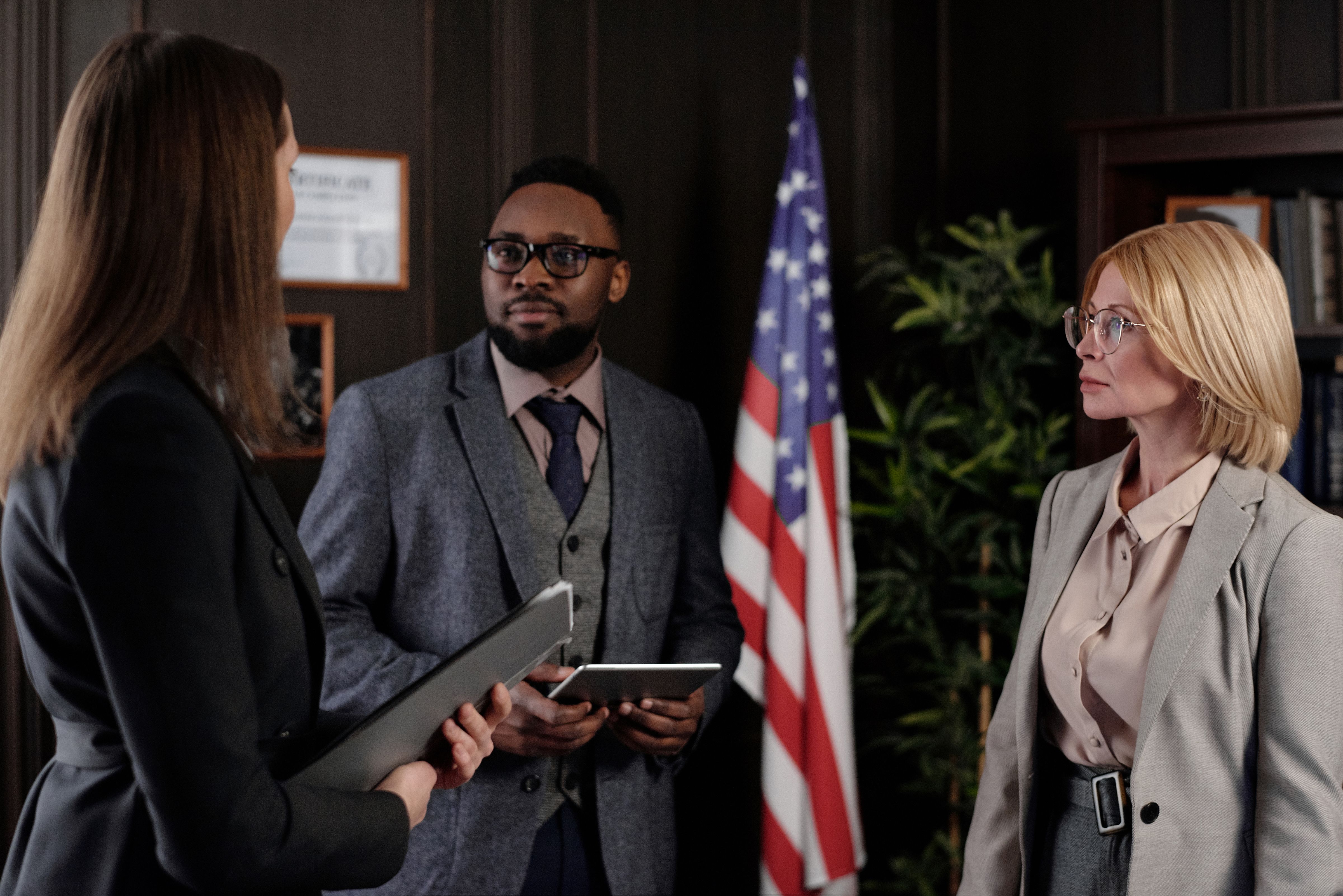 Attorney and client reviewing an immigration matter in a professional office